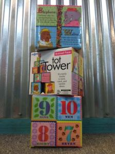 The Tot Tower (ages 2+) provides 10 sturdy blocks to, "stack, nest, and topple down." With charming illustrations and poems on each side, they're sure to inspire hours of creative play!